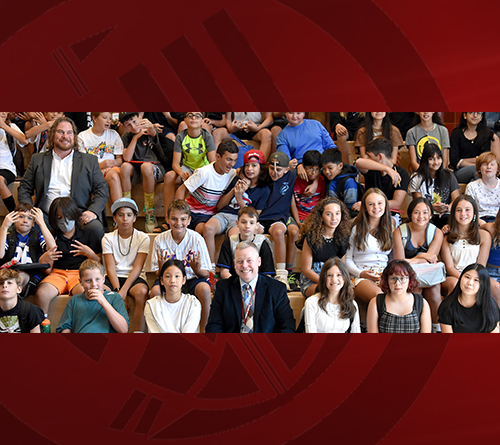 Students and Principal sitting at a table